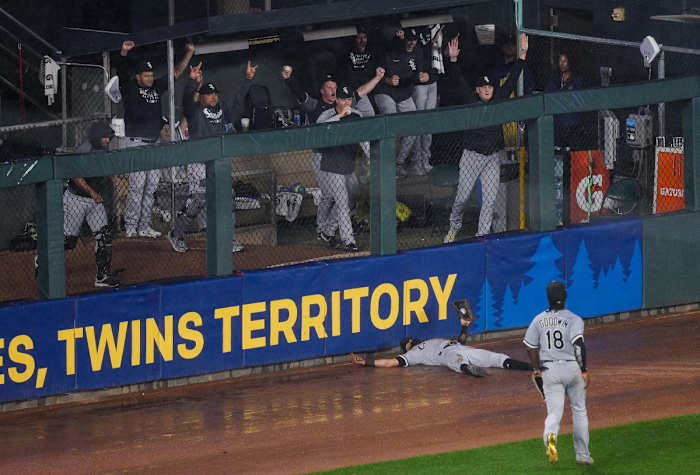 Jul 6, 2021; Minneapolis, Minnesota, USA; The Chicago White Sox bullpen celebrates outfielder Billy Hamilton (0) diving catch against the Minnesota Twins in the ninth inning at Target Field.
